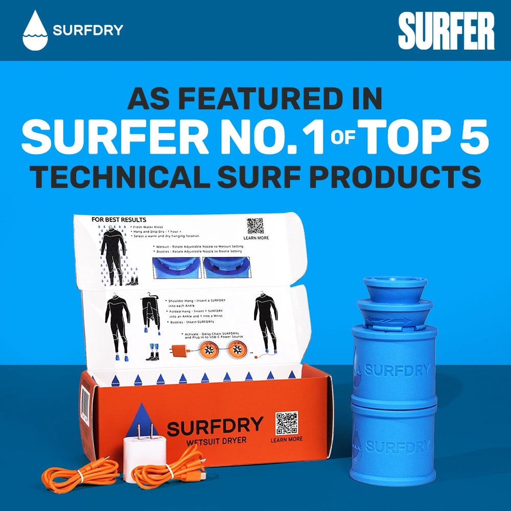 Surfdry surf product set with packaging and blue container on a blue background, featuring Surfer magazine text.
